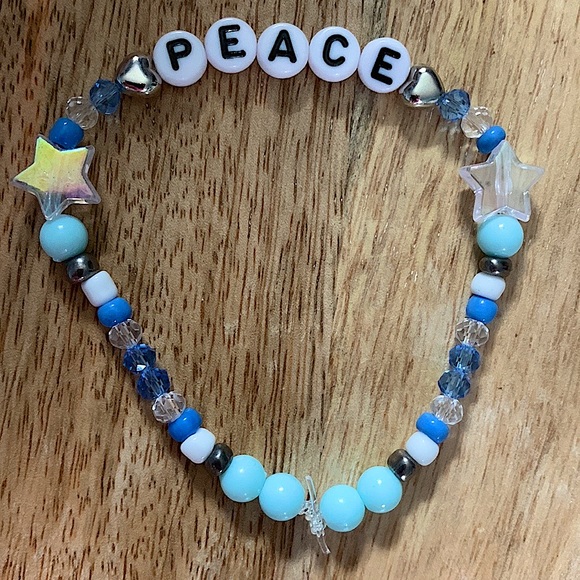 5 for $20 Taylor Swift Handmade Friendship Beaded Bracelet
“Peace” - Picture 1 of 2